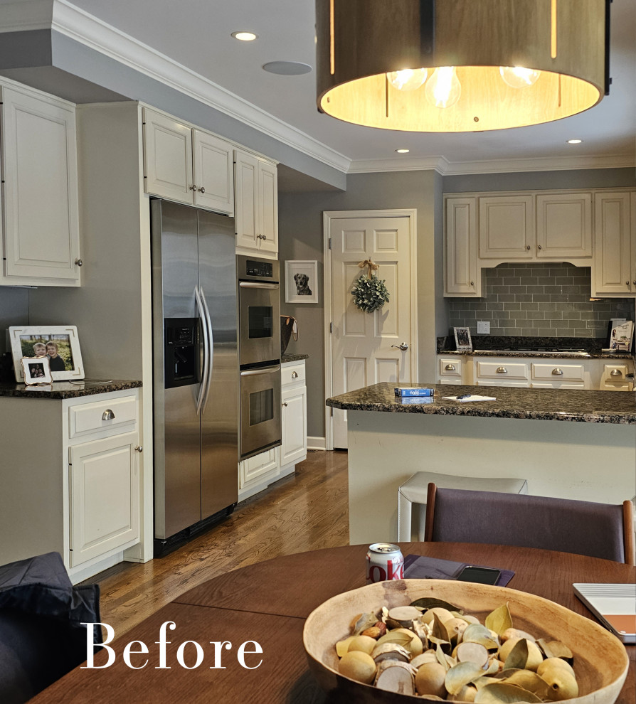 Large transitional l-shaped medium tone wood floor and brown floor eat-in kitchen photo in Chicago with an undermount sink, flat-panel cabinets, white cabinets, solid surface countertops, white backsplash, marble backsplash, paneled appliances, an island and black countertops