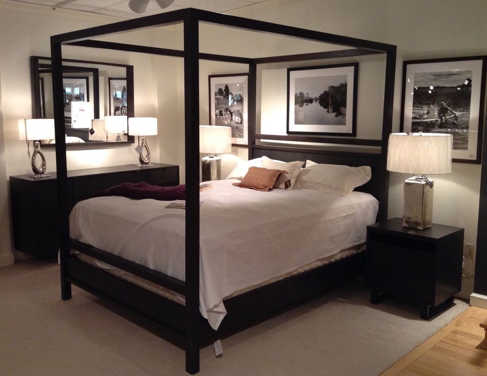Example of a mid-sized transitional master light wood floor bedroom design with gray walls