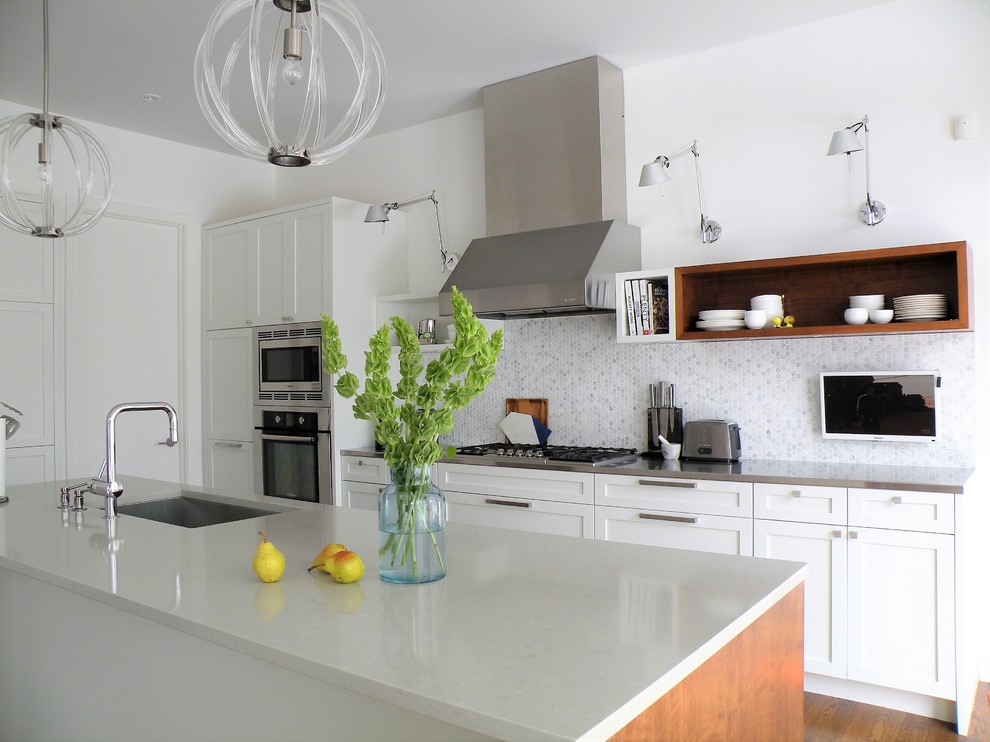 Example of a large transitional galley dark wood floor open concept kitchen design in Ottawa with an undermount sink, shaker cabinets, white cabinets, quartzite countertops, mosaic tile backsplash, stainless steel appliances and an island