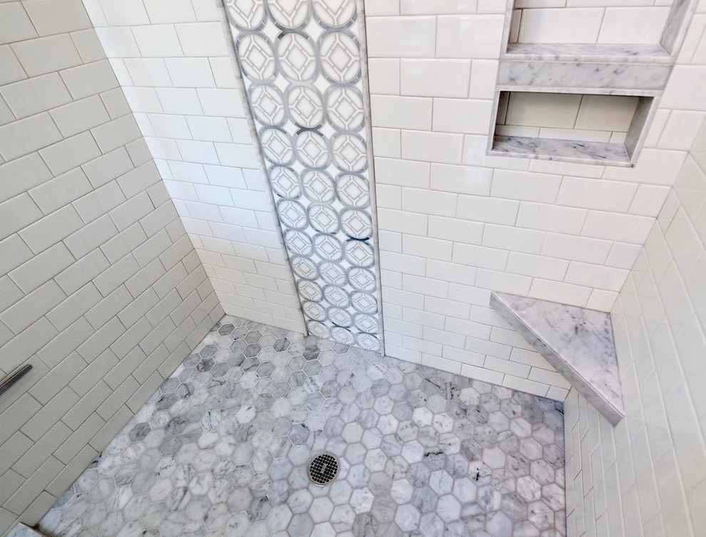 Inspiration for a mid-sized transitional master bathroom in Portland with raised-panel cabinets, white cabinets, an alcove shower, white tile, subway tile, grey walls, porcelain floors, an undermount sink, solid surface benchtops, grey floor and a sliding shower screen.