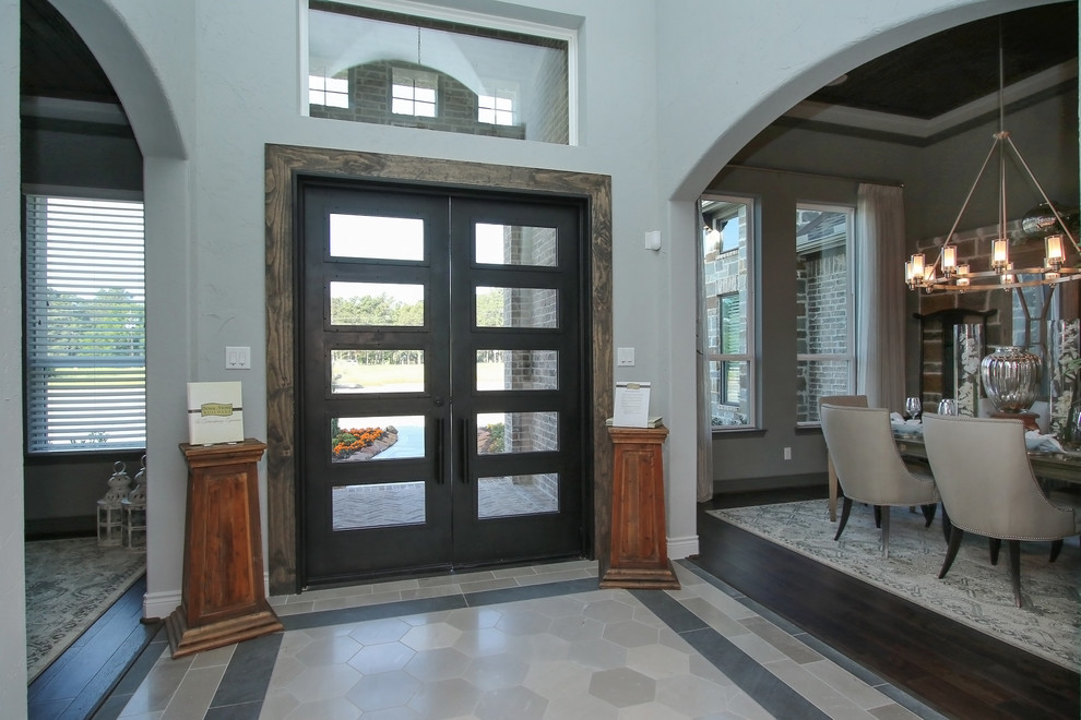 Large transitional foyer in Houston with grey walls, ceramic floors, a double front door, a black front door and grey floor.