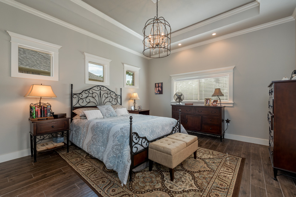 This is an example of a small arts and crafts master bedroom in Other with grey walls, ceramic floors and brown floor.