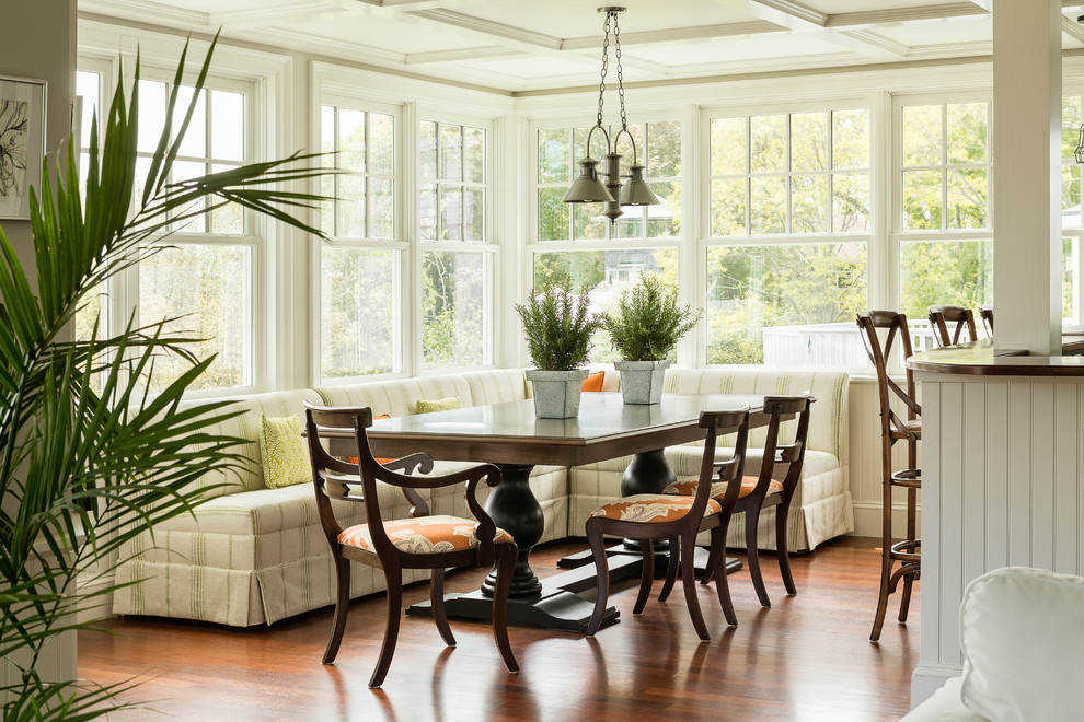Photo of a beach style open plan dining in Portland Maine with medium hardwood floors.