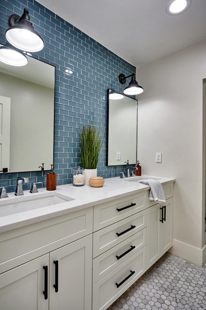 Photo of a transitional kids bathroom in Denver with shaker cabinets, white cabinets, blue tile, porcelain tile, grey walls, marble floors, an undermount sink, engineered quartz benchtops, grey floor, white benchtops, a double vanity and a built-in vanity.