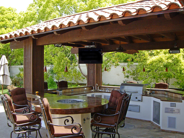 Outdoor Kitchen With Round Table And Pergola Mediterran