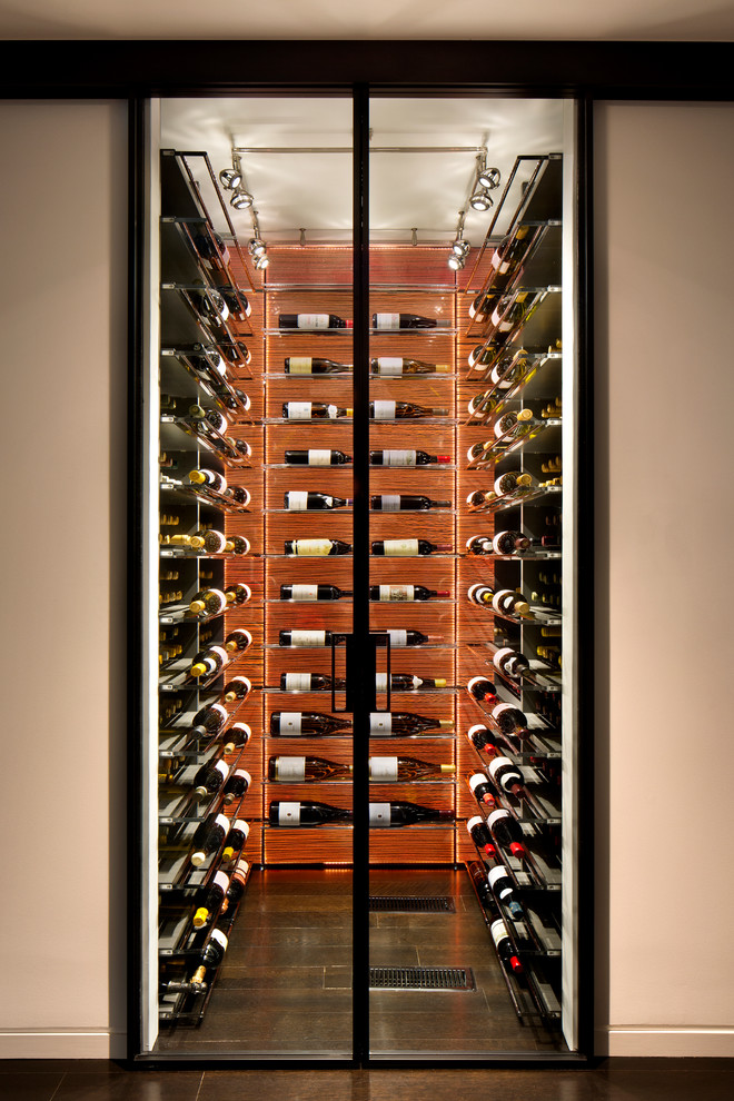 This is an example of a small contemporary wine cellar in San Francisco with storage racks and porcelain floors.