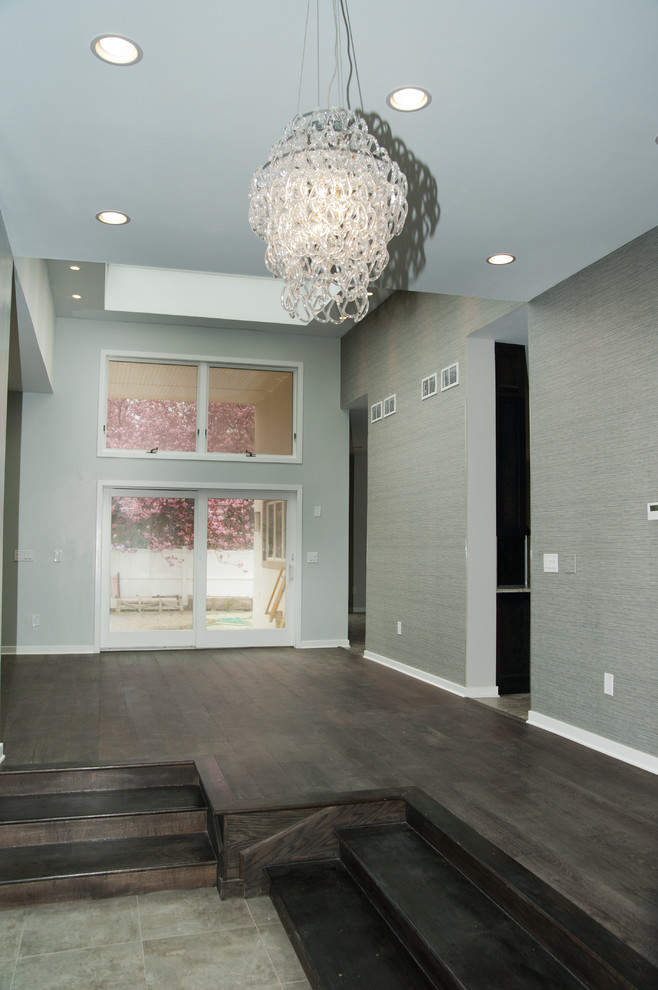 Mid-sized contemporary hallway in New York with grey walls and dark hardwood floors.
