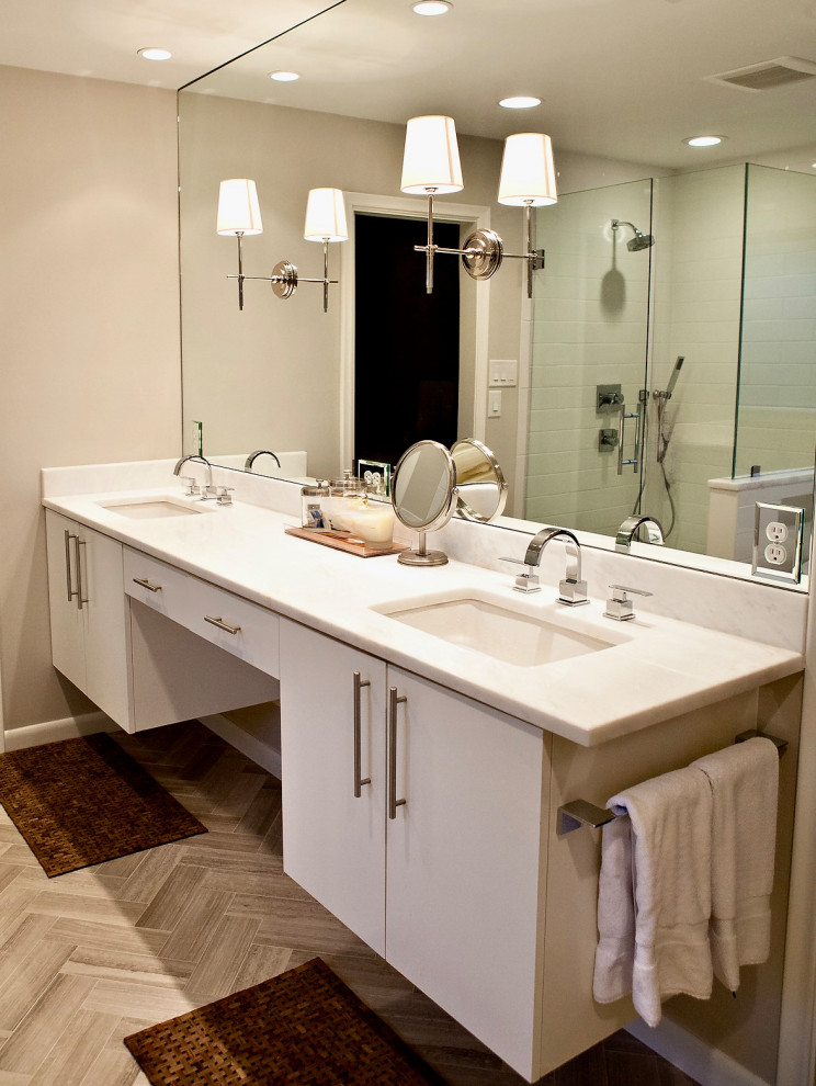 Custom wood floating smooth panel cabinets for a modern look Real solid marble countertops for a timeless neutral classic look that compliments the modern plumbing fixtures and modern cabinets