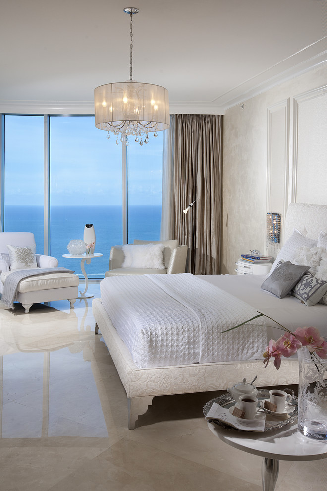 Design ideas for a contemporary bedroom in Miami with beige walls, no fireplace and marble floors.