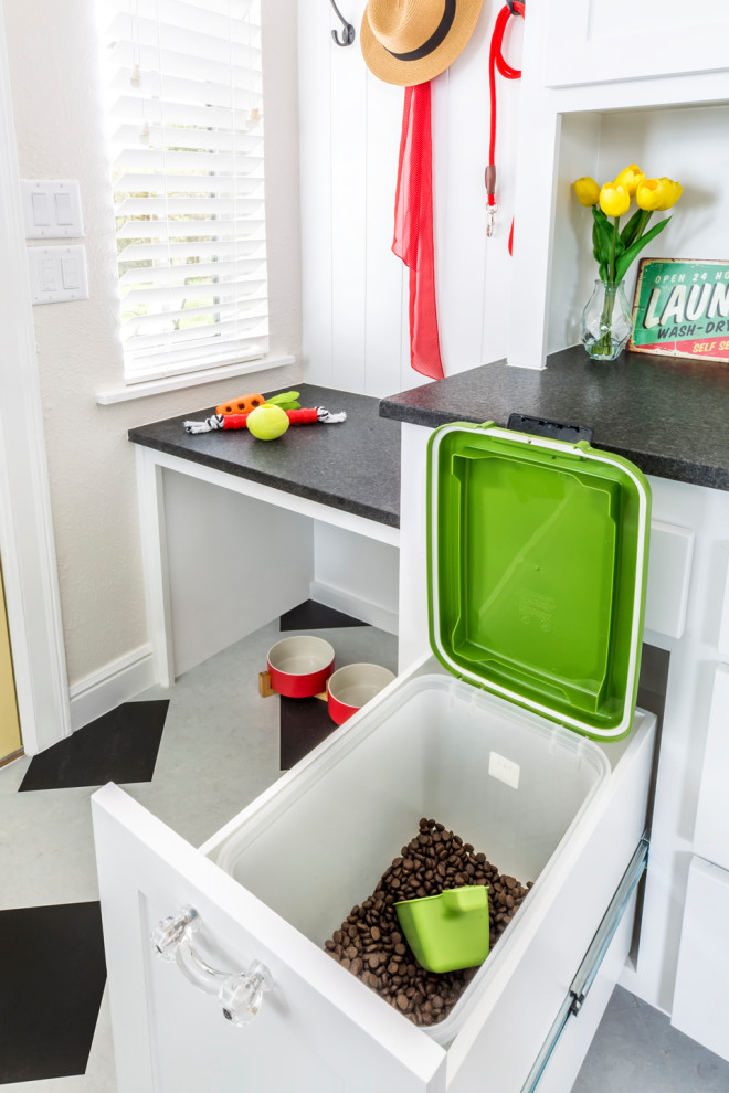 Inspiration for a small traditional galley separate kitchen in Dallas with an undermount sink, shaker cabinets, white cabinets, granite benchtops, green splashback, ceramic splashback, white appliances, bamboo floors, multi-coloured floor and black benchtop.