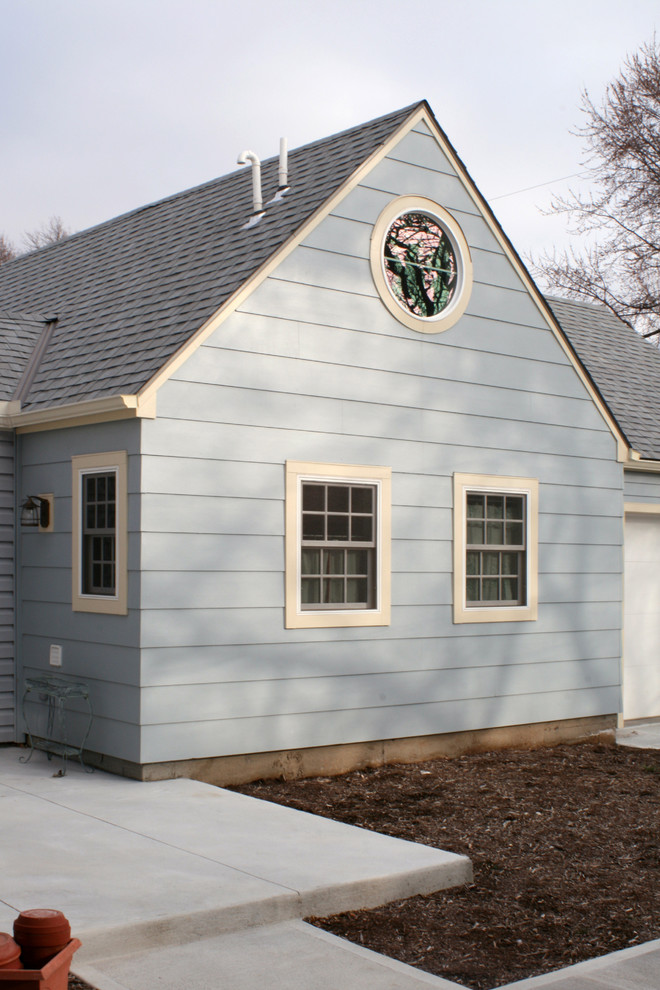 This is an example of a mid-sized eclectic attached one-car workshop in Kansas City.