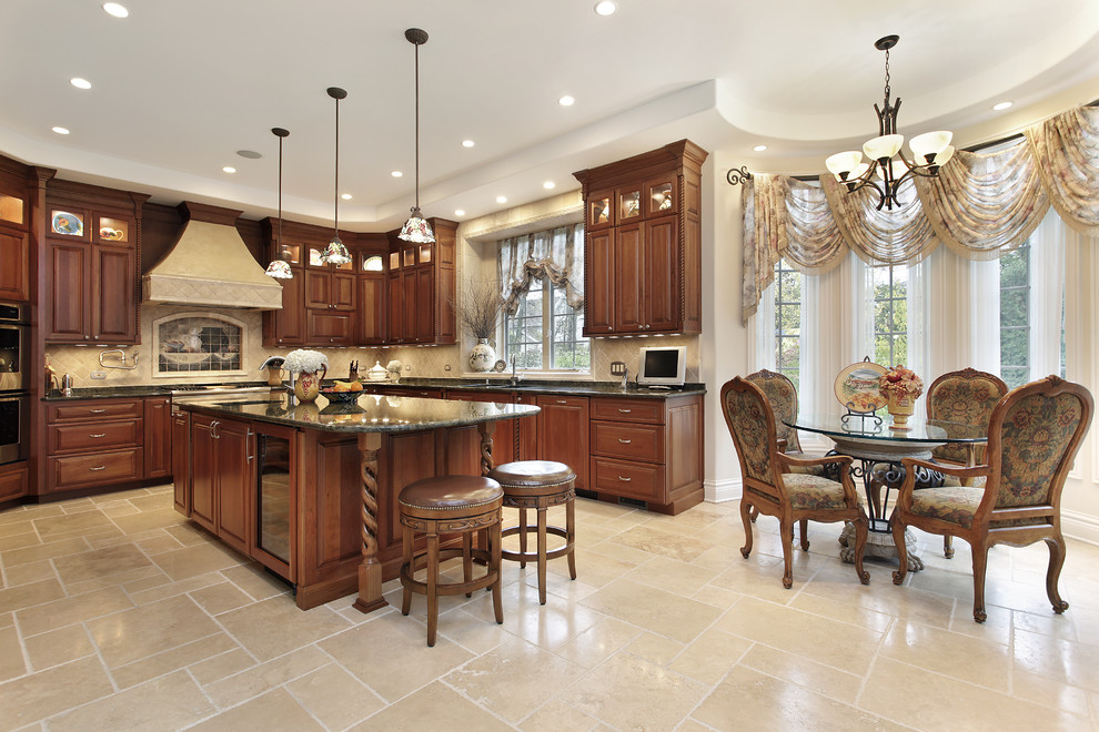 Large traditional l-shaped eat-in kitchen in Los Angeles with raised-panel cabinets, dark wood cabinets, beige splashback, with island, marble benchtops, ceramic floors, a double-bowl sink, porcelain splashback, stainless steel appliances and beige floor.