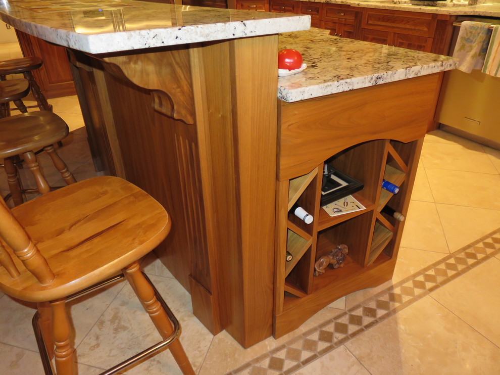 Large transitional l-shaped ceramic tile open concept kitchen photo with raised-panel cabinets, medium tone wood cabinets, granite countertops, an island, a double-bowl sink, white backsplash, subway tile backsplash and stainless steel appliances