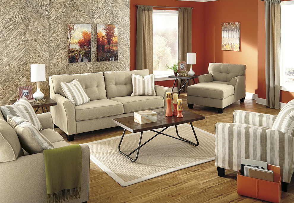 Design ideas for a contemporary living room in Houston with orange walls and medium hardwood floors.