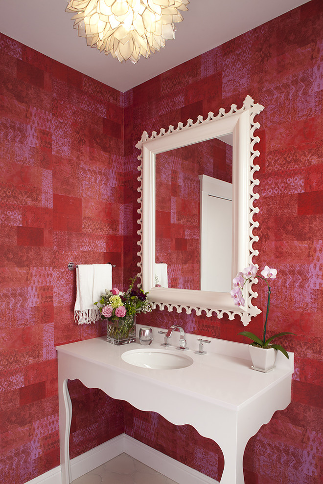 Photo of an eclectic powder room in San Francisco with an undermount sink, furniture-like cabinets, white cabinets and red walls.