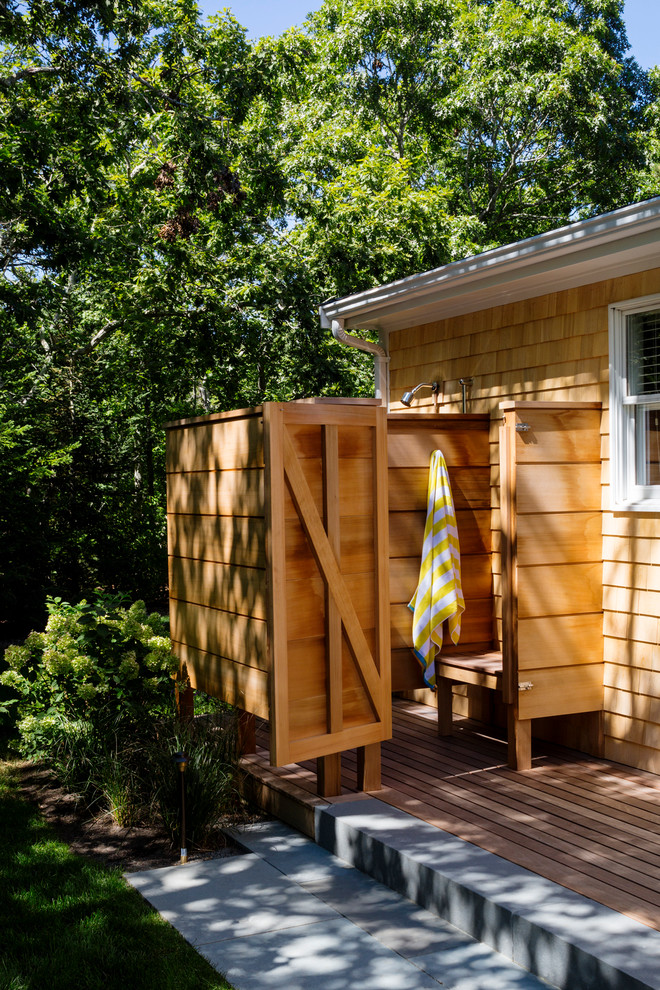Photo of a beach style patio in Boston with an outdoor shower.