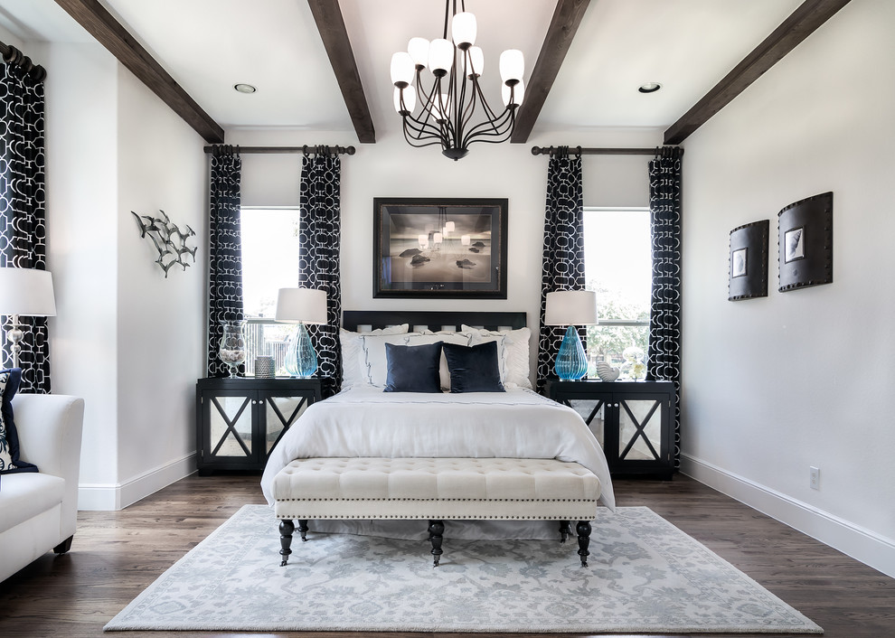 Photo of a large master bedroom in Dallas with white walls, dark hardwood floors and black floor.