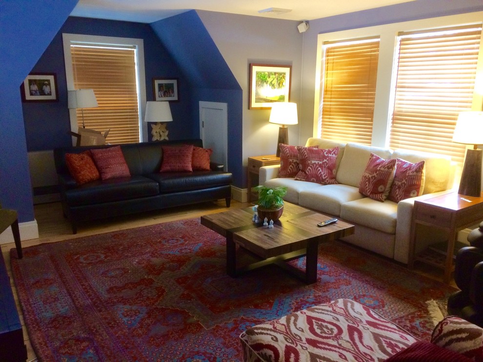 Mid-sized eclectic enclosed home theatre in Boston with blue walls and bamboo floors.