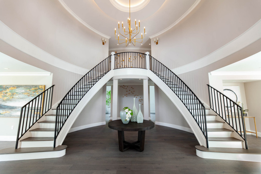 Photo of an expansive traditional foyer in Vancouver with grey walls, medium hardwood flooring, a double front door, grey floors, a coffered ceiling and all types of wall treatment.