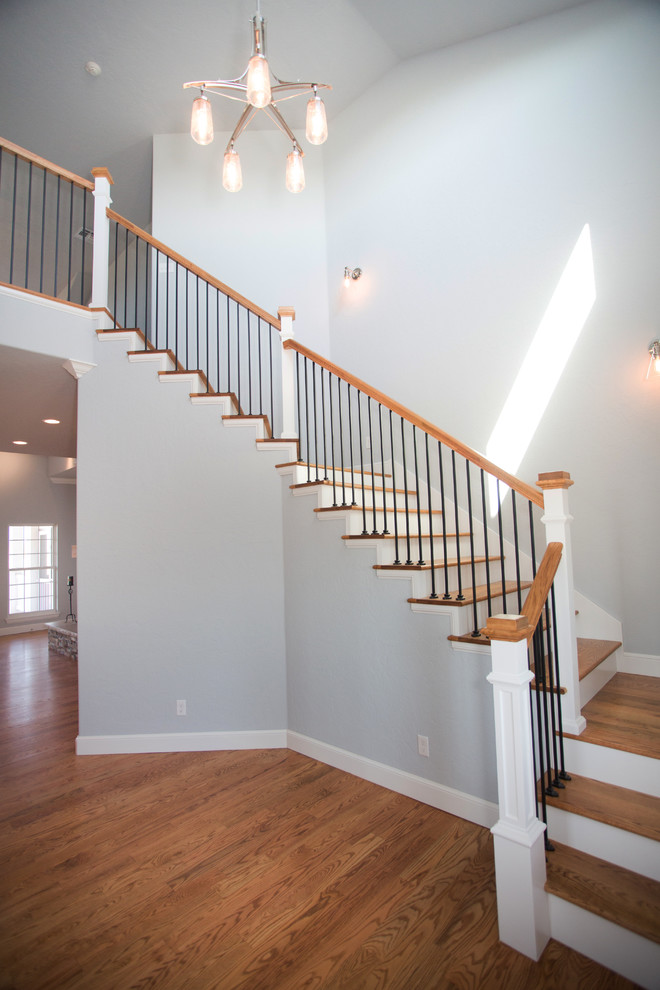 Design ideas for a large transitional staircase in Orange County.