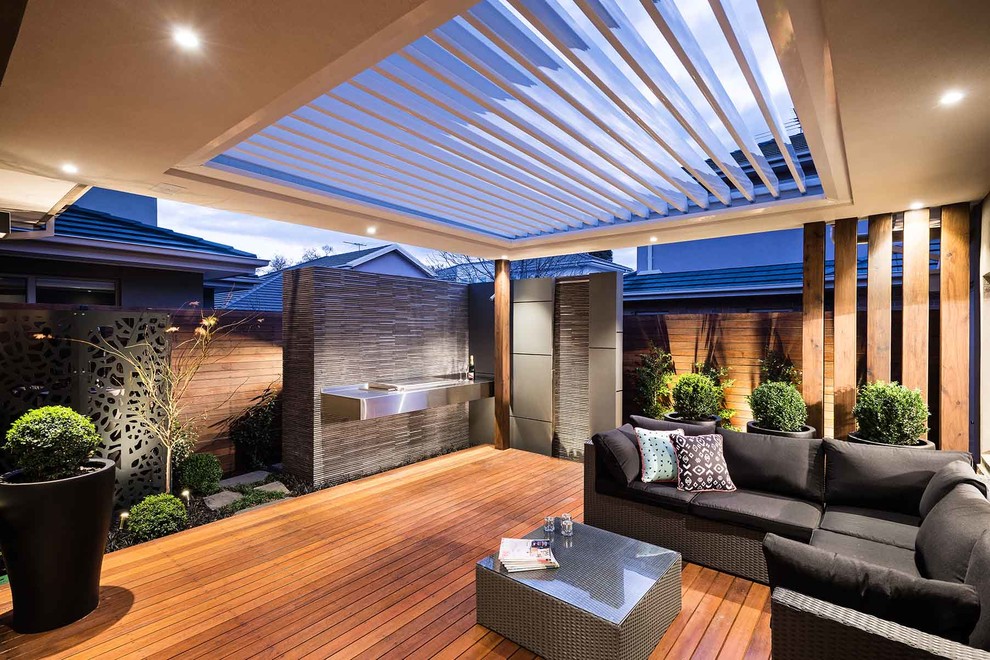 Inspiration for a contemporary backyard deck in Melbourne with a pergola.