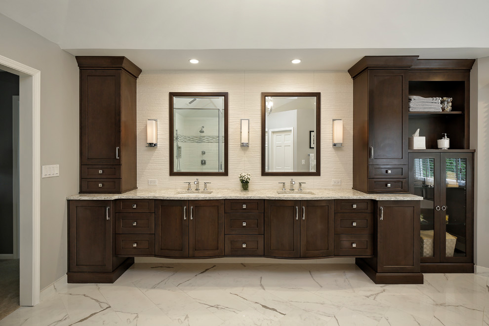 Large transitional master bathroom in Chicago with shaker cabinets, dark wood cabinets, a freestanding tub, a corner shower, grey walls, porcelain floors, an undermount sink, granite benchtops and a hinged shower door.