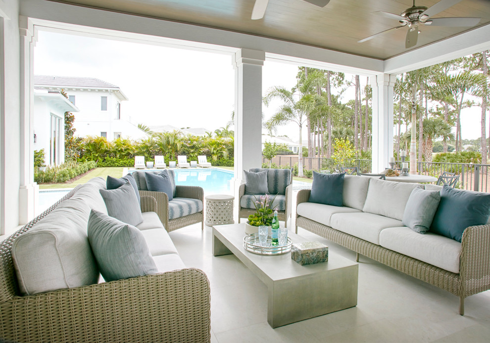Inspiration for a backyard patio remodel in Miami with a roof extension