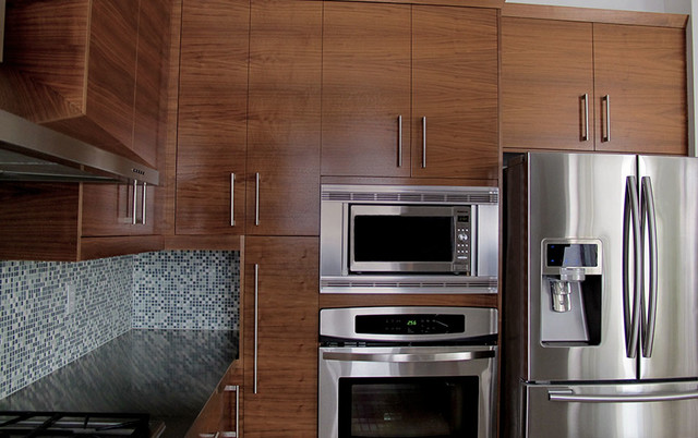 Walnut Kitchen With Stainless Steel Countertop Modern Kitchen