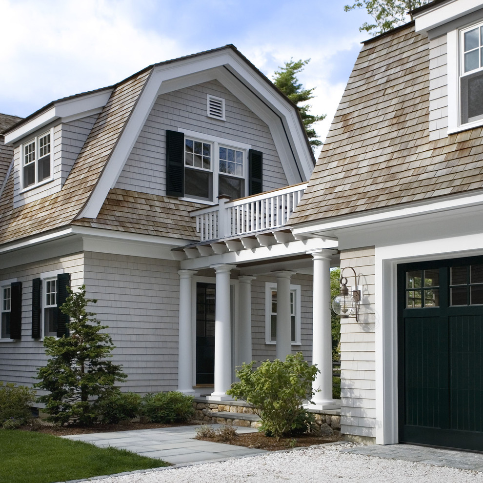 Inspiration for a traditional exterior in Boston with wood siding and a gambrel roof.