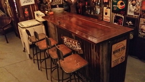 rustic bar made out of antique door for bar top and rusted corrugated ...