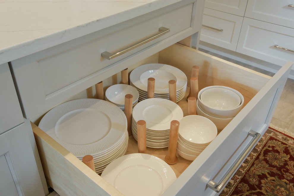 Inspiration for a transitional ceramic tile kitchen remodel in Seattle with shaker cabinets, white cabinets, quartzite countertops, subway tile backsplash, stainless steel appliances, an island and white countertops