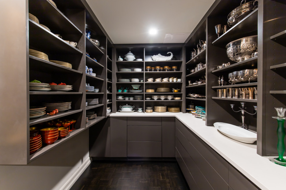Design ideas for a mid-sized contemporary u-shaped kitchen pantry in Dallas with flat-panel cabinets, grey cabinets, quartz benchtops, dark hardwood floors, no island, black floor and white benchtop.