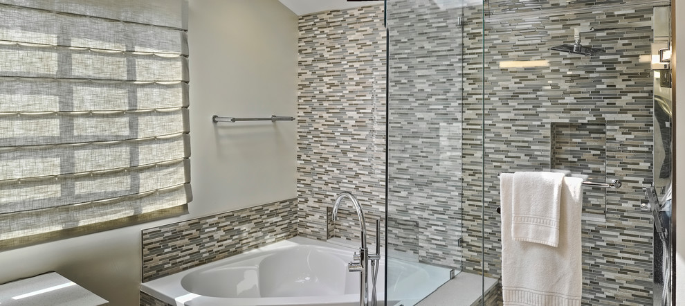 This is an example of a mid-sized contemporary master bathroom in Los Angeles with flat-panel cabinets, medium wood cabinets, engineered quartz benchtops, a corner tub, a corner shower, multi-coloured tile, mosaic tile, white walls and porcelain floors.