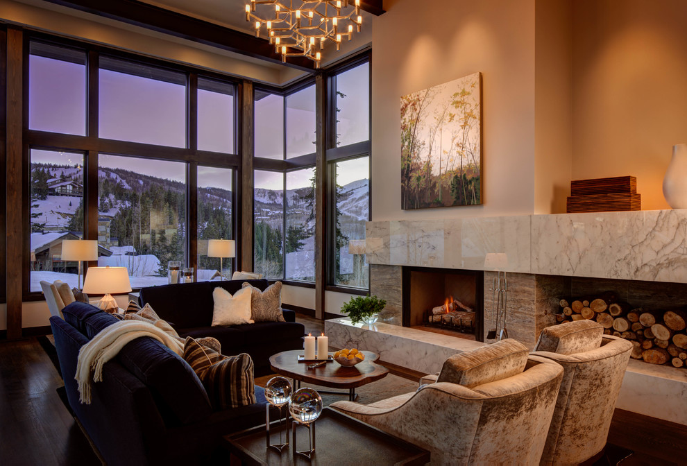 Photo of a large contemporary formal open concept living room in Salt Lake City with beige walls, a standard fireplace, dark hardwood floors, no tv, brown floor and a stone fireplace surround.