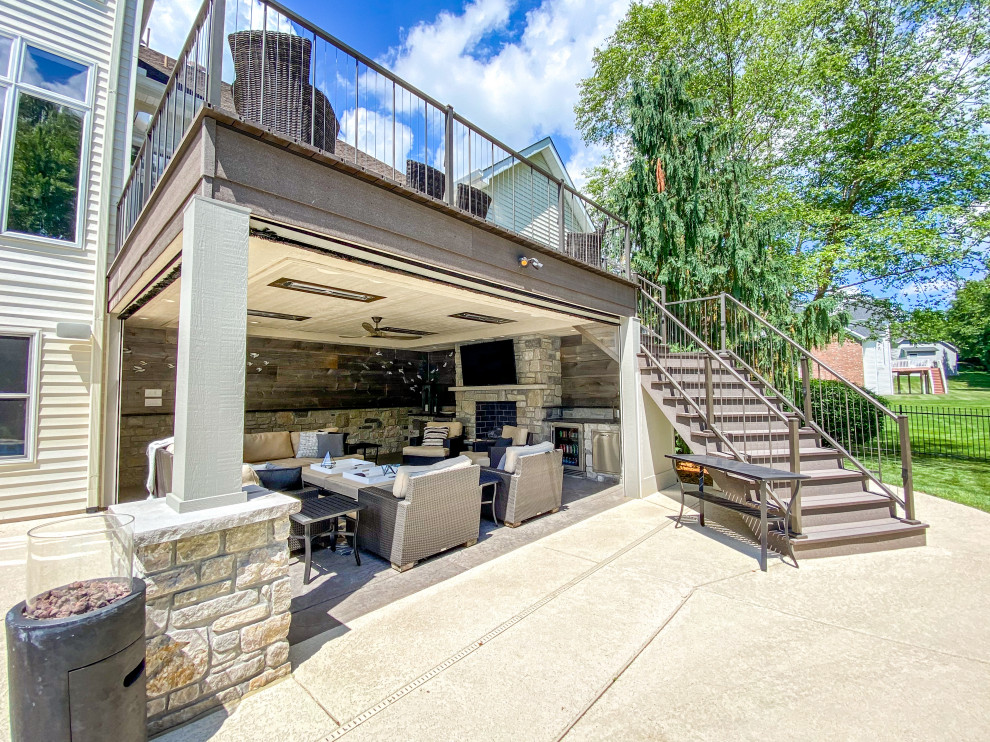 Mid-sized backyard second story metal railing deck photo in St Louis with a fire pit