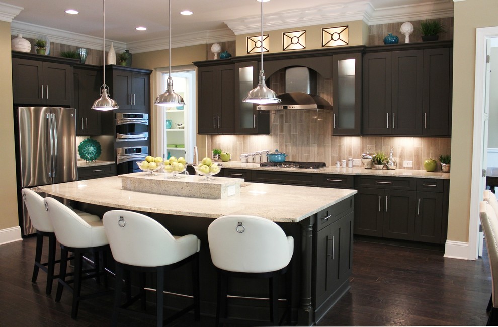 Photo of a large transitional l-shaped kitchen in Other with flat-panel cabinets, grey cabinets, dark hardwood floors and with island.