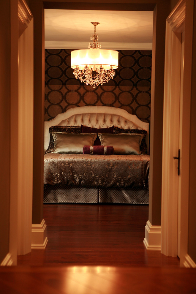 Inspiration for a large traditional master bedroom in Toronto with brown walls, dark hardwood floors and no fireplace.