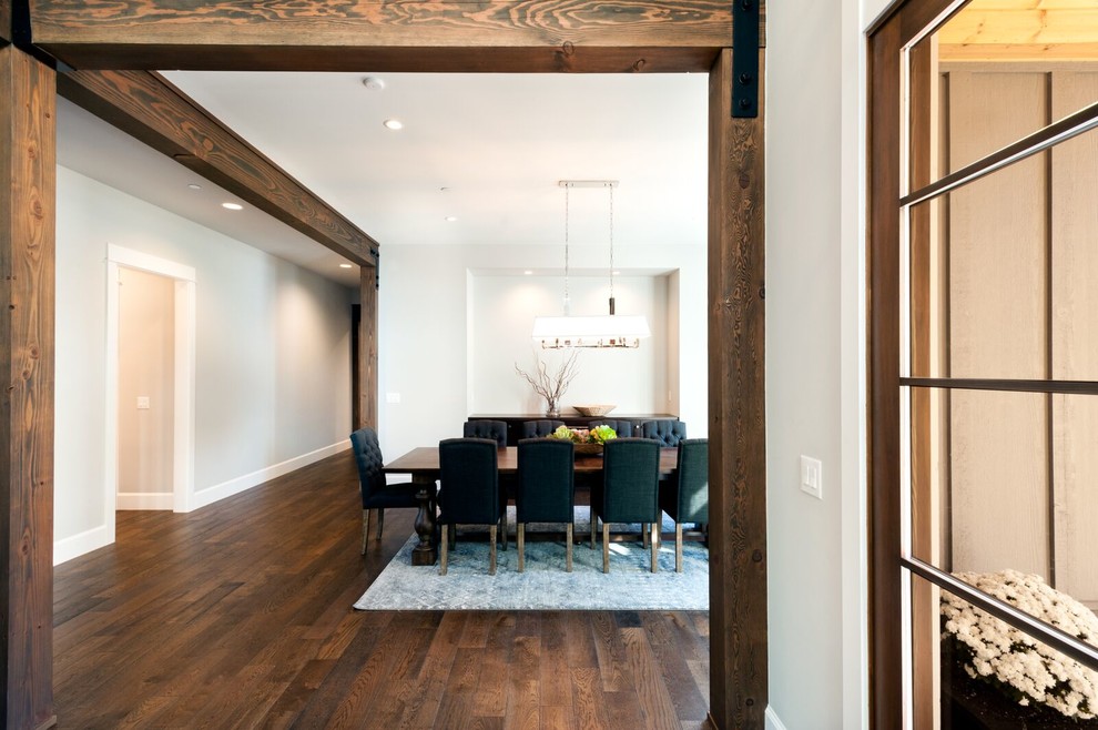 Photo of an expansive arts and crafts separate dining room in Seattle with grey walls, dark hardwood floors and brown floor.