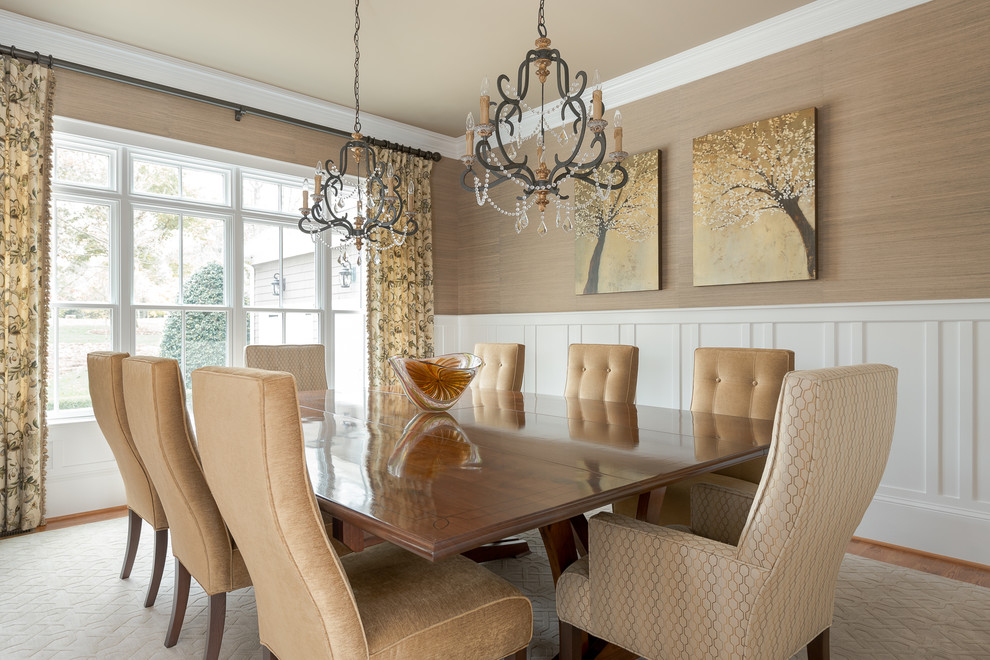 Inspiration for a traditional dining room in Charlotte with brown walls, medium hardwood floors and brown floor.