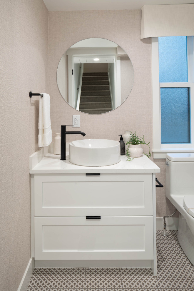 Inspiration for a small coastal cloakroom in Vancouver with shaker cabinets, white cabinets, a one-piece toilet, white tiles, beige walls, porcelain flooring, a vessel sink, quartz worktops, white floors, white worktops, a built in vanity unit and wallpapered walls.