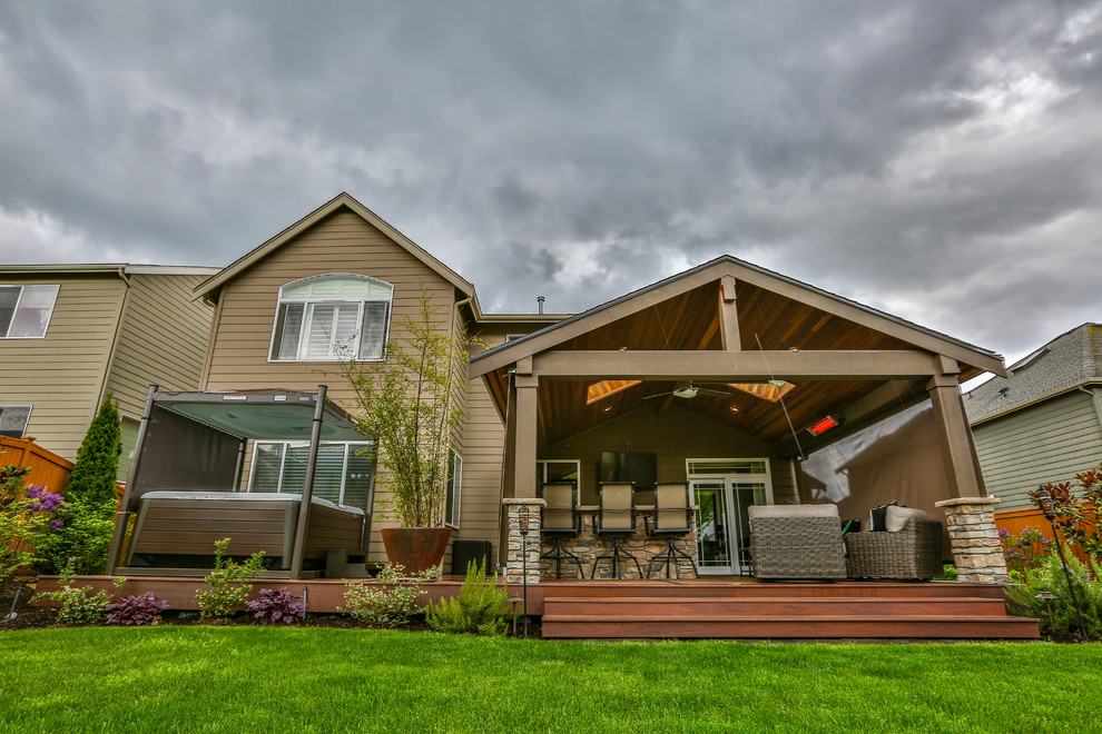 Large traditional brown two-story vinyl gable roof idea in Seattle with a shingle roof