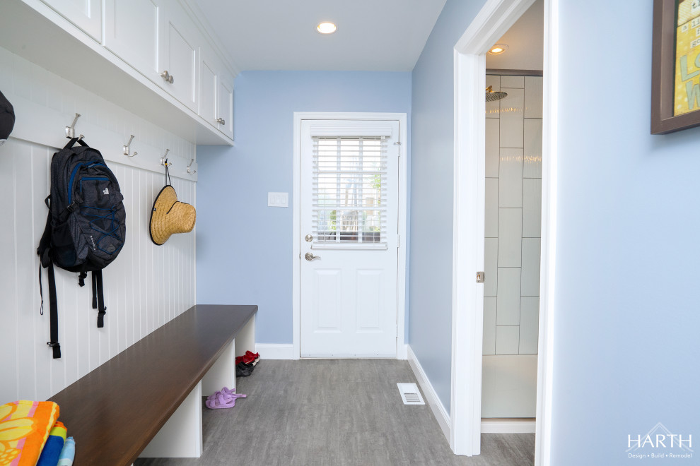Mid-sized transitional mudroom in Philadelphia with blue walls, vinyl floors, a single front door, a white front door and grey floor.