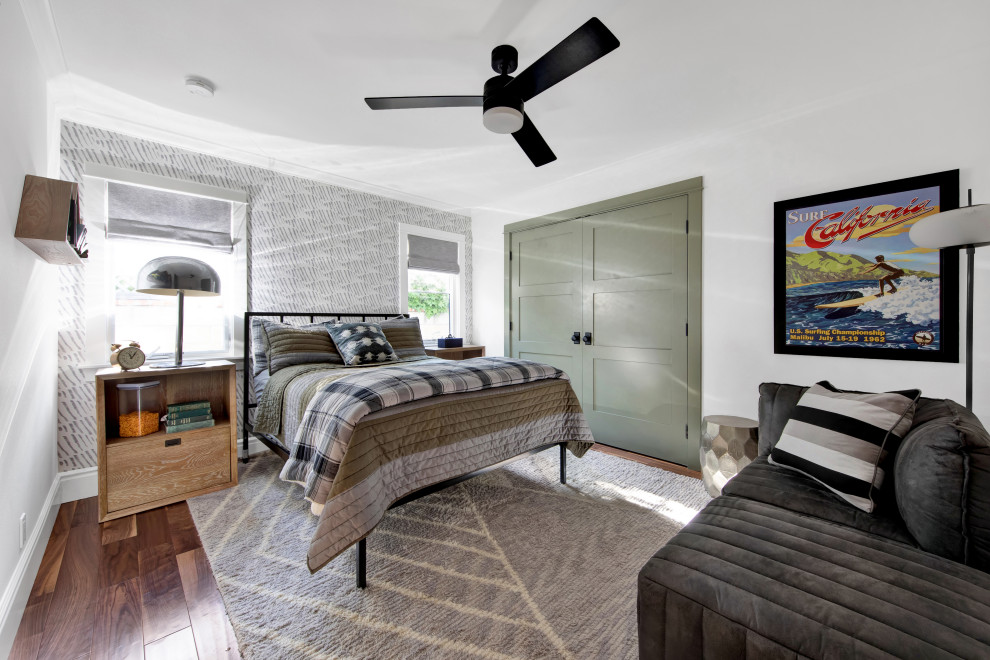 Mid-sized country guest medium tone wood floor and brown floor bedroom photo in Los Angeles with white walls and no fireplace