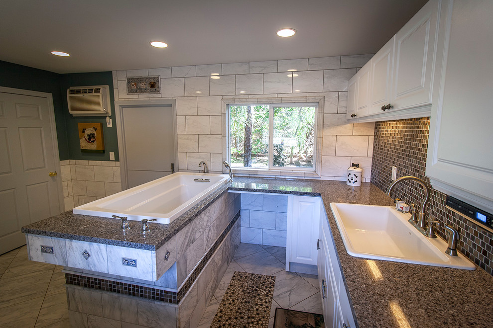 Large transitional u-shaped utility room in San Diego with a single-bowl sink, shaker cabinets, white cabinets, granite benchtops, white walls, marble floors and a side-by-side washer and dryer.