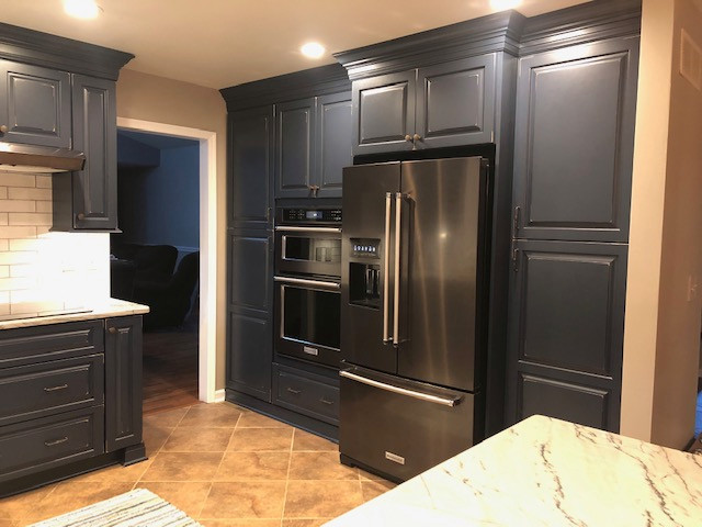 Dark Blue Cabinetry Makes for a Warm & Welcoming Kitchen