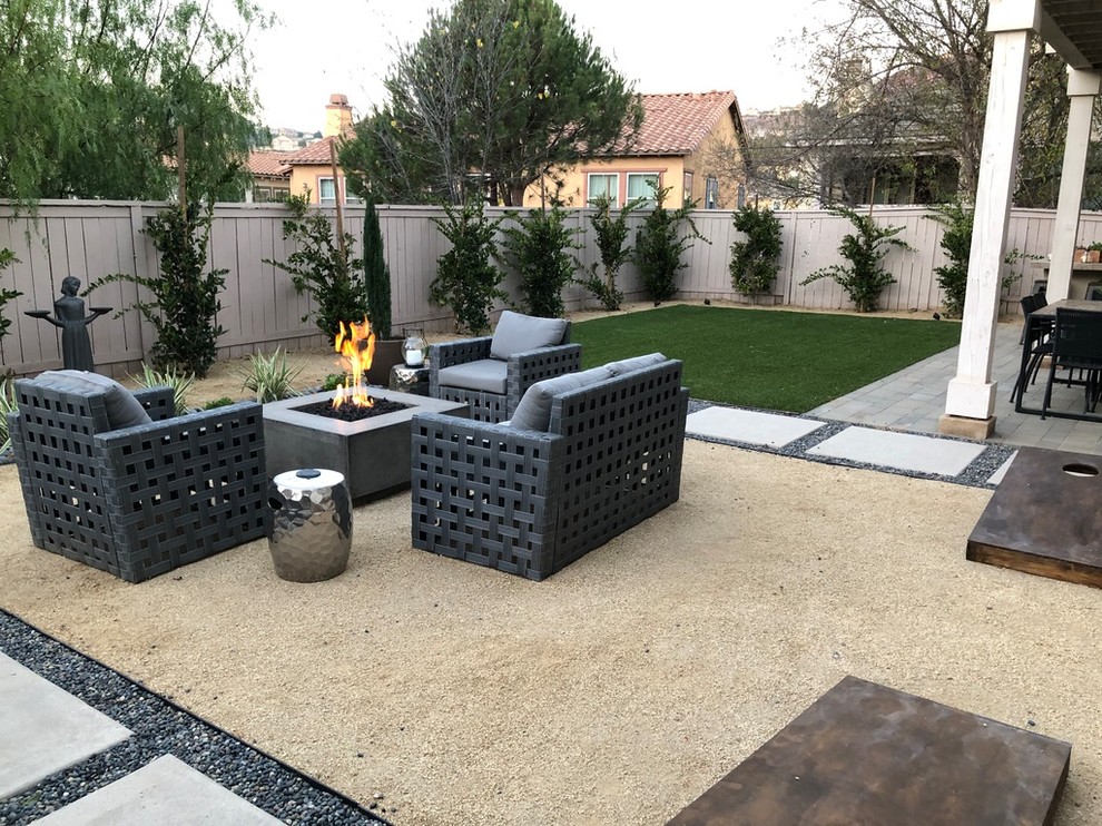 Inspiration for a contemporary patio in San Diego with a fire feature and concrete pavers.