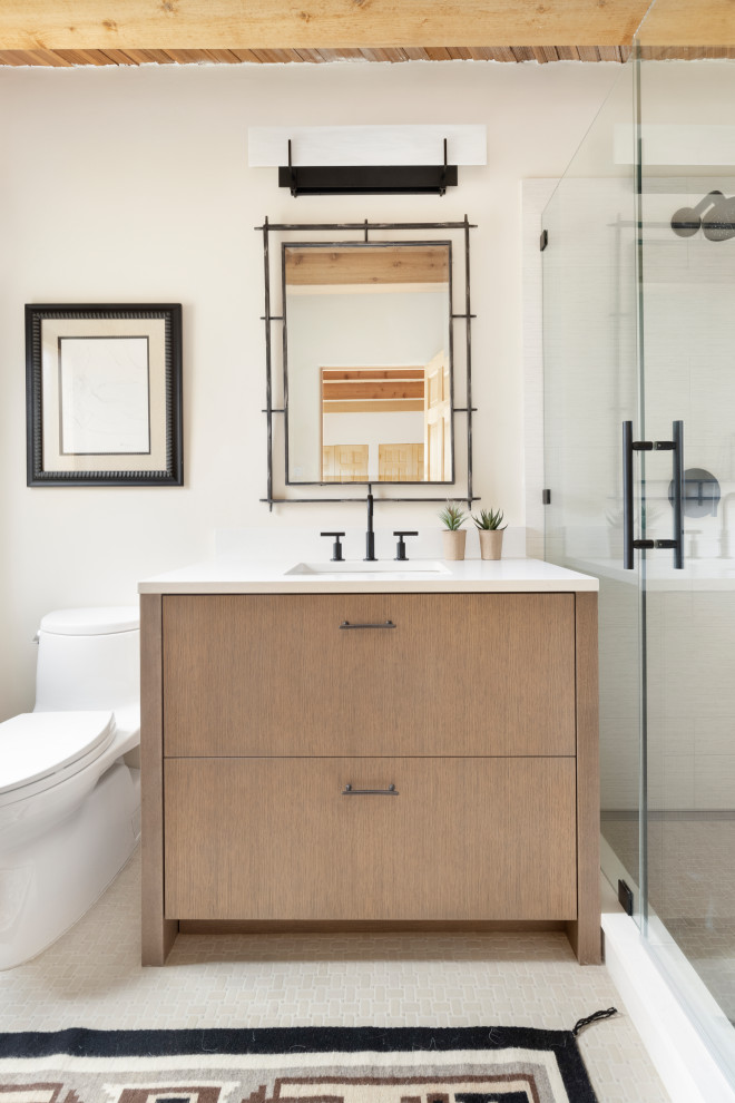 Photo of a mid-sized 3/4 wet room bathroom in Albuquerque with flat-panel cabinets, porcelain floors, beige floor, a hinged shower door, a single vanity, a built-in vanity and wood.