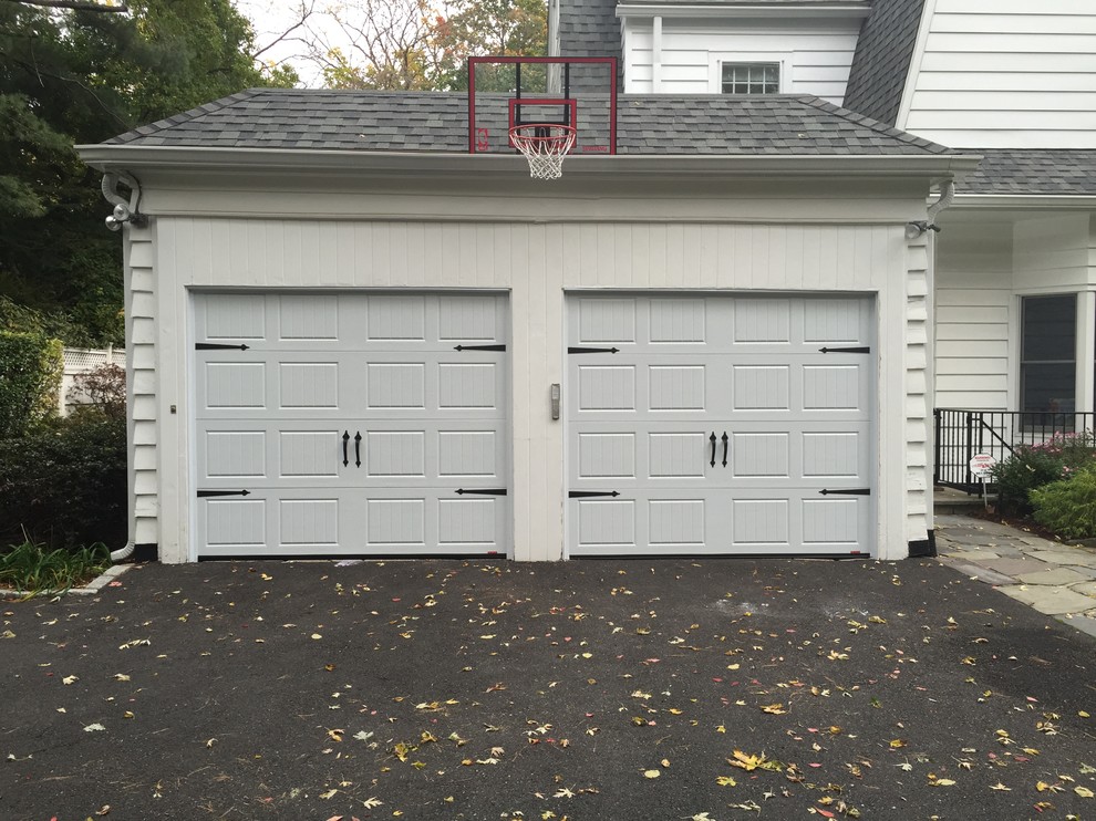 This is an example of a mid-sized contemporary attached two-car carport in New York.