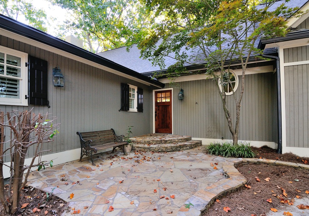 This is an example of a traditional front door in Atlanta with a single front door and a dark wood front door.