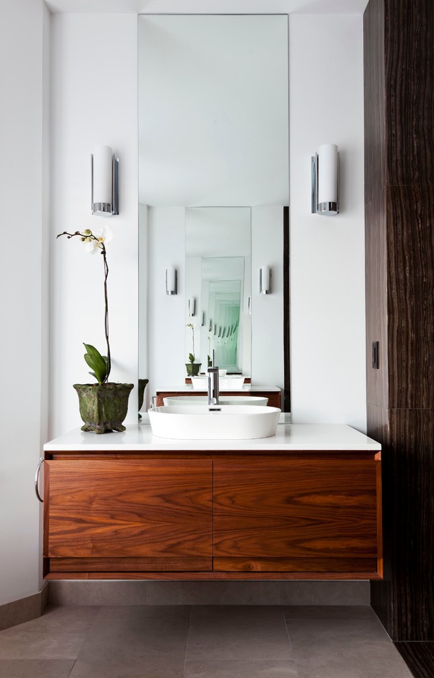 Mid-sized contemporary 3/4 bathroom in Toronto with flat-panel cabinets, medium wood cabinets, white walls, ceramic floors, a vessel sink, quartzite benchtops, grey floor and white benchtops.